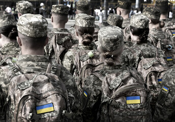 Ukrainian soldiers. Women in army. Ukrainian flag in military uniform.