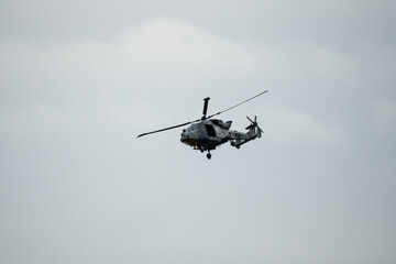 Wall Mural - British army AgustaWestland AW159 Wildcat AH1 helicopter in low level flight, Wilts UK