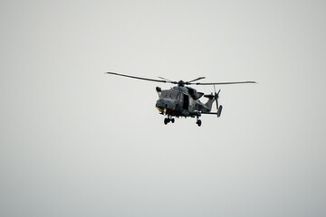 Wall Mural - British army AgustaWestland AW159 Wildcat AH1 helicopter in low level flight, Wilts UK