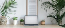 Front View Of Laptop On Work Table With White Wall Background, Isolated With Clipping Path.