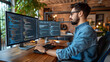 © safu designe - Male tester coding on desktop computer with two monitors set up in creative office
