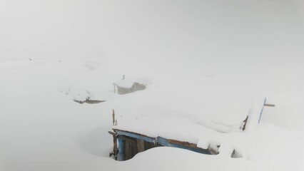 Wall Mural - Germaneska meadow in the Carpathians, Ukraine, in the summer live shepherds of cows and sheep, and in winter fog and snowfall cover the roof