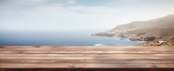 Wall Mural - wooden table with a blurry ocean view