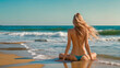 © Pixel_Studio_8 - Topless Vacation woman in bikini sitting on the seashore on a paradise beach enjoying her free time sunbathing topless with her back to the camera. Beach vacation concept. Copy space