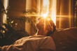 A person receiving EMDR therapy to process and heal from past traumas. A man is being Comfortable in bed, feeling the warm sunlight streaming through the curtains to fill the room