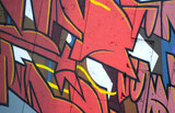 Fototapeta Młodzieżowe - Colorful background of graffiti painting artwork with bright aerosol outlines on wall. Old school street art piece made with aerosol spray paint cans. Contemporary youth culture backdrop