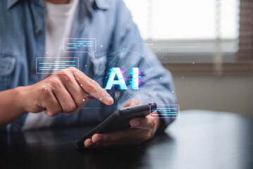 Aufkleber - Concept of artificial intelligence and the potential for technology to enhance human communication and interaction. A person is using a cell phone to interact with a blue screen that says AI