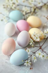  A serene still life of pastel-colored Easter eggs arranged aesthetically with delicate spring flowers