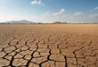 Dry cracked land without crops to horizon. Dead soil and agricultural problems. Concept of global warming and drying up of rivers. Ai generation