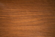 A photo of a clean wooden covering.The background is made of natural mahogany.Premium furniture finishing materials.