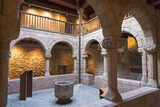 Fototapeta Londyn - Abbatial Palace Cloister in Sant Joan de les Abadesses,  Catalonia