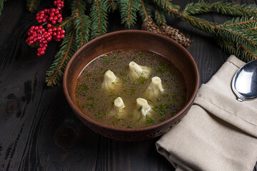 Wall Mural - soup with dumplings on wooden background