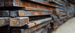 stack of steel beams in a warehouse 