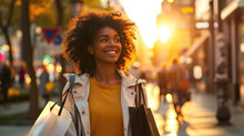 Joyful Young Woman With Blonde, Curly Hair Is Carrying Shopping Bags And Smiling As She Walks Down A Bustling City Street