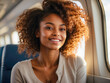 African American girl sits on an airplane. Traveling around the world