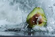 Avocado with water splash, close-up. Healthy food concept.