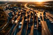 A drone shot of a massive highway accident during golden hour, highlighting the shadows cast by the entangled vehicles and emergency services on the scene.