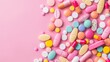 Pink background with many types of medicines.