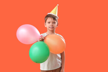 Sticker - Cute little boy with party hat and balloons on orange background. April Fool's Day celebration