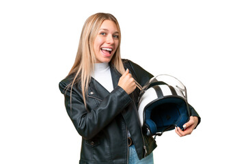 Wall Mural - Young pretty blonde woman with a motorcycle helmet over isolated chroma key background celebrating a victory