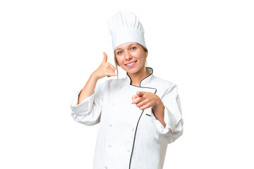 Wall Mural - Young chef woman over isolated chroma key background making phone gesture and pointing front