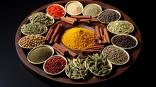 Variety Of Colorful Spices And Herbs Arranged In Segments Of A Round Wooden Tray On A Dark Backdrop, Highlighting Culinary Diversity