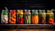Brightly lit jars filled with various canned vegetables exhibit a delightful arrangement on a rustic wooden shelf