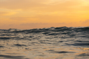 Canvas Print - ocean view with orange sunrise sky.