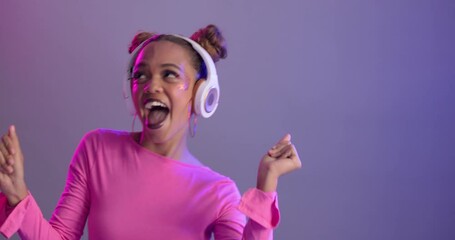 Sticker - Woman, dancing and happy with headphones in studio or streaming entertainment or music, stress relief or listen. Female person, neon light and purple background or techno audio, glitter or mockup