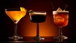 Three elegantly presented cocktails in silhouette with a warm amber backlighting setting a mood