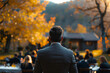 A businessman leading a corporate retreat in a serene countryside retreat center.