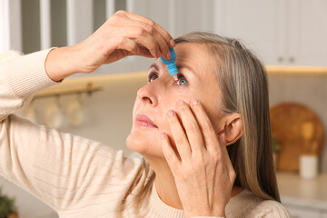 Poster - Woman applying medical eye drops at home