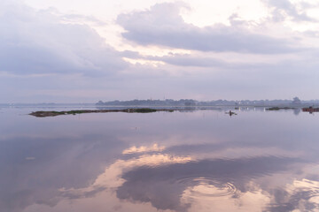 Wall Mural - Reflection of lake with sunset sky. Nature landscape background.