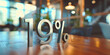 Number 19% in metal letters on wooden table, percentage of interest or profit