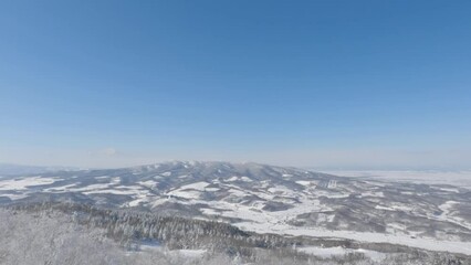 Wall Mural - aerial shot of winter landscape valley view, asahikawa, hokkaido, japan