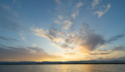 Wall Mural - Sunset sky. Abstract nature background. Dramatic blue with orange colorful clouds in twilight time.