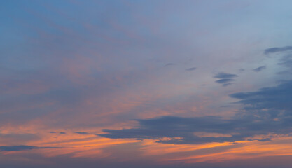 Wall Mural - Sunset sky. Abstract nature background. Dramatic blue with orange colorful clouds in twilight time.