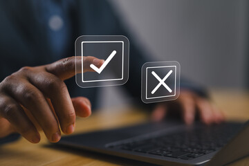 select the check mark on a laptop. check right and wrong marks. concept decide to choose vote. yes o