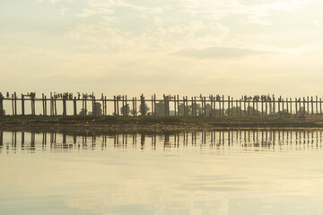 U Bein Bridge with lake, Wooden Bridge in Mon village, Myanmar or Burma, Asia.