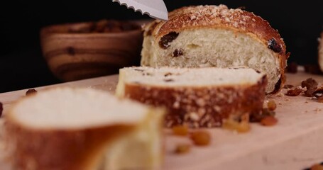 Wall Mural - sweet wheat bun with raisins on the table, sweet bun with golden raisins