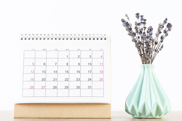 Wall Mural - Calendar page with lavender flowers on white background