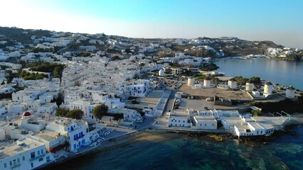 Wall Mural - Mykonos Greece, colorful streets of the old town of Mykonos, Traditional narrow street with blue doors and white walls, Mykonos town Greece, drone view at sunrise