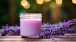 lavender scented candle, purple color glass candle jar, on a wooden table top with lavender flowers.and copy space