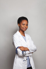 Wall Mural - Physician woman medical worker in lab coat on white background