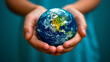 © FILIP ROCH - Concept of Environmental Care, Ecology, Sustainability and Climate Awareness: Hands Holding an Earth Globe. Happy Earth Day Concept.