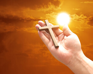 Wall Mural - Cross in arm at sunset. Good Friday concept. 3d illustration