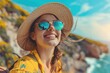 A woman wearing a hat and sunglasses on a sunny beach. Ideal for travel and vacation concepts