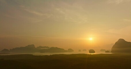Fototapete - Aerial view Imagine a beautiful bright yellow sky at sunrise..stunning view of the beautiful Phang Nga Bay. .beautiful yellow sunrise at Samet Nangshe landmark of Phang Nga Thailand. .gradien sky.