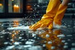 Hands in Yellow Gloves Washing Floor with Soap Suds