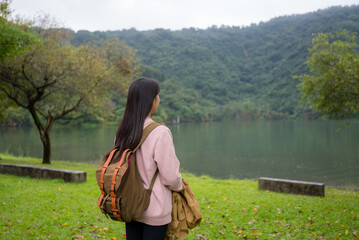 Sticker - Woman enjoy the lake view in the countryside